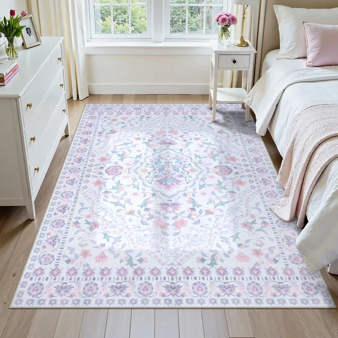 Covaba vintage persian floral area rug in muted plum, styled in a room setting