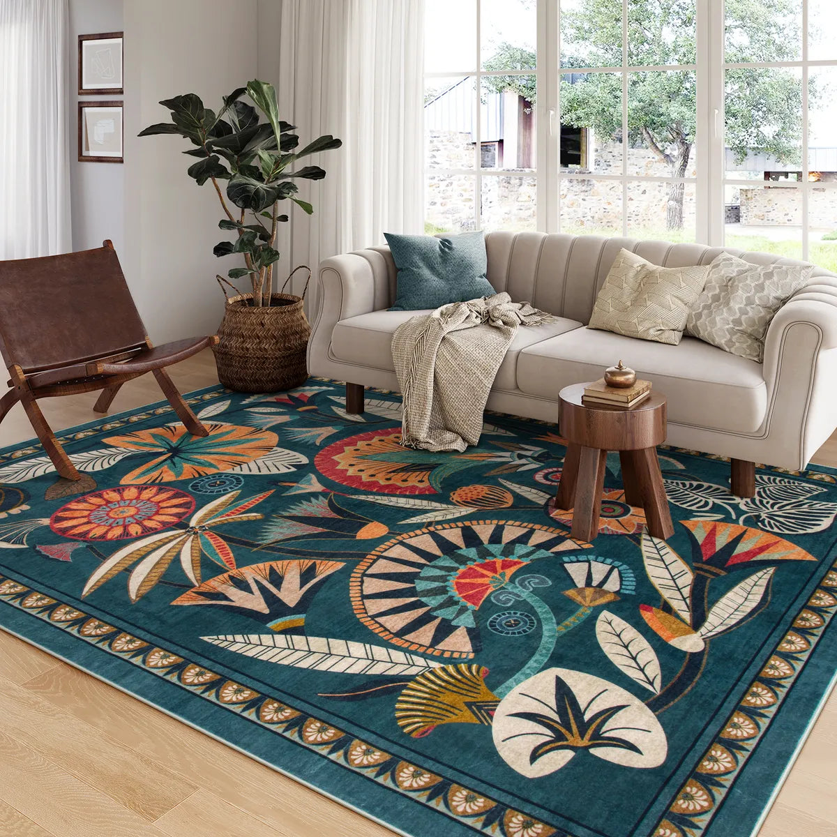Covaba egyptian-inspired botanical area rug in teal haze, styled in a room setting