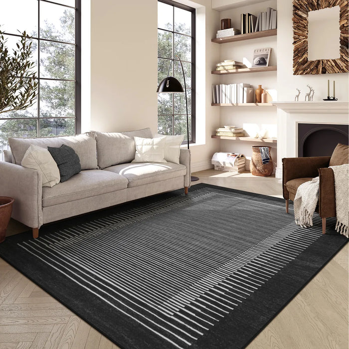 Covaba modern minimalist line area rug in ink black, styled in a room setting