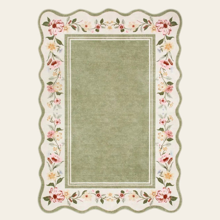 Covaba vintage floral scalloped doormat in willow sage, shown flat on a plain ivory backdrop