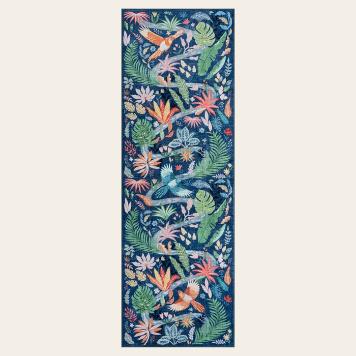 Covaba modern tropical bird runner rug in stormy blue, shown flat on a plain ivory backdrop