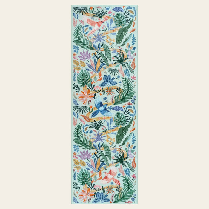 Covaba modern tropical bird runner rug in fern green, shown flat on a plain ivory backdrop