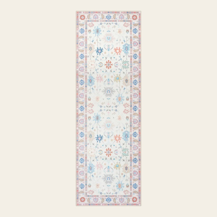 Covaba boho oushak floral runner rug in blush clay, shown flat on a plain ivory backdrop