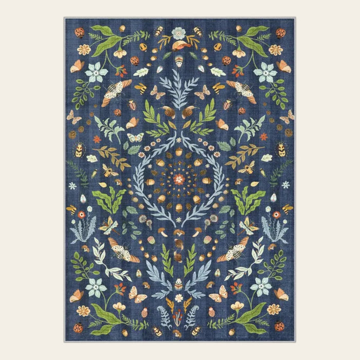 Covaba boho insect botanical floral doormat in stormy blue, shown flat on a plain ivory backdrop