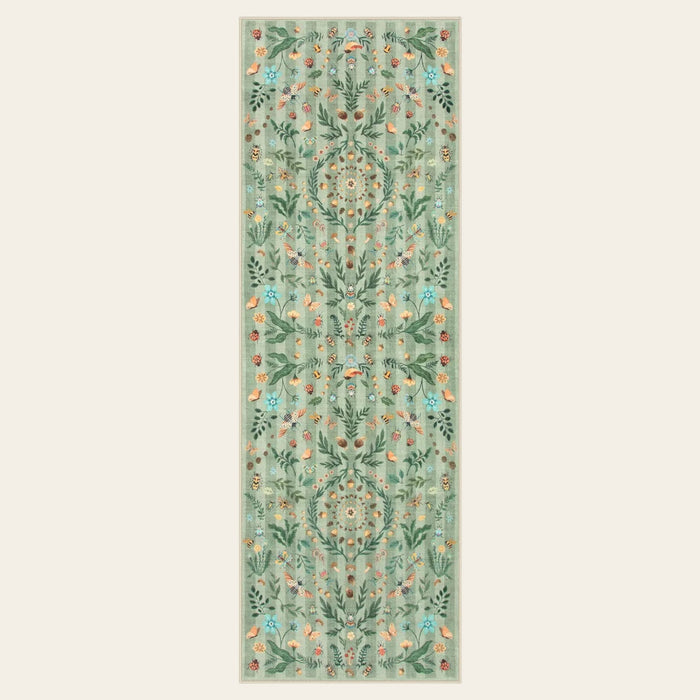Covaba boho insect botanical floral runner rug in fern green, shown flat on a plain ivory backdrop