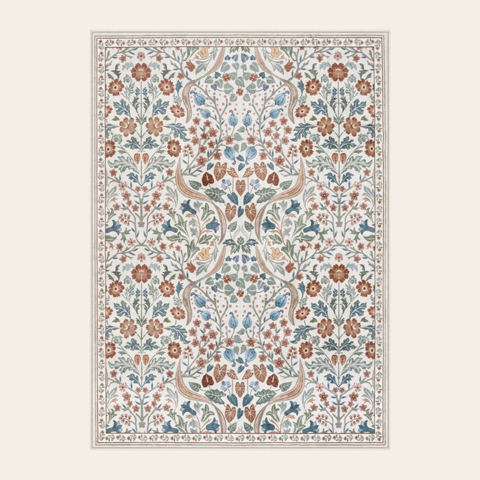 Covaba maximalism vibrant blossom floral area rug in warm beige, shown flat on a plain ivory backdrop