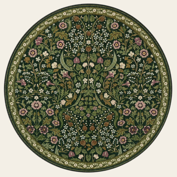 Covaba maximalism vibrant blossom floral round rug in forest fern, shown flat on a plain ivory backdrop