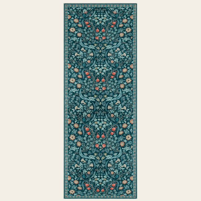 Covaba maximalism vibrant floral runner rug in teal haze, shown flat on a plain ivory backdrop