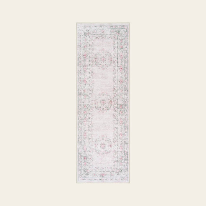 Covaba vintage traditional floral runner rug in blush clay, shown flat on a plain ivory backdrop