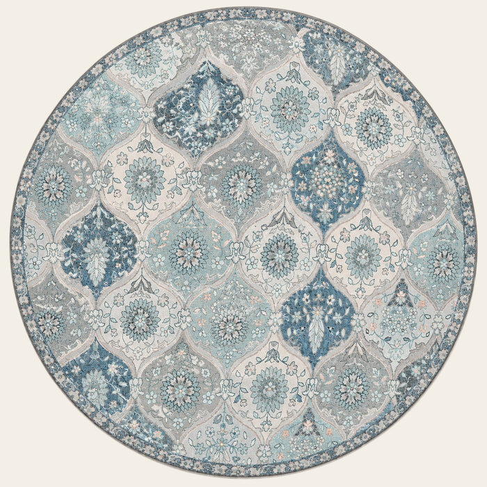 Covaba ultra-thin vintage floral moroccan trellis round rug in stormy blue, shown flat on a plain ivory backdrop