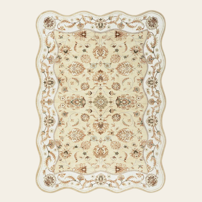 Covaba vintage botanical scalloped area rug in warm beige, shown flat on a plain ivory backdrop