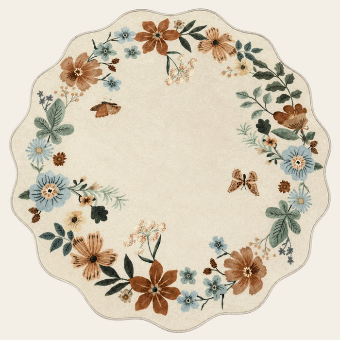 Covaba boho modern parisian floral scalloped round rug in warm beige, shown flat on a plain ivory backdrop