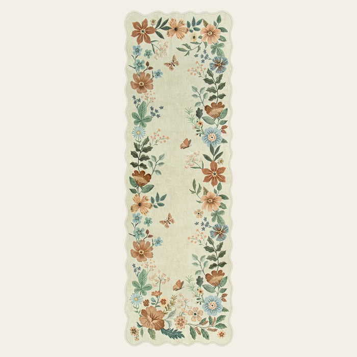 Covaba boho modern parisian floral scalloped runner rug in warm beige, shown flat on a plain ivory backdrop