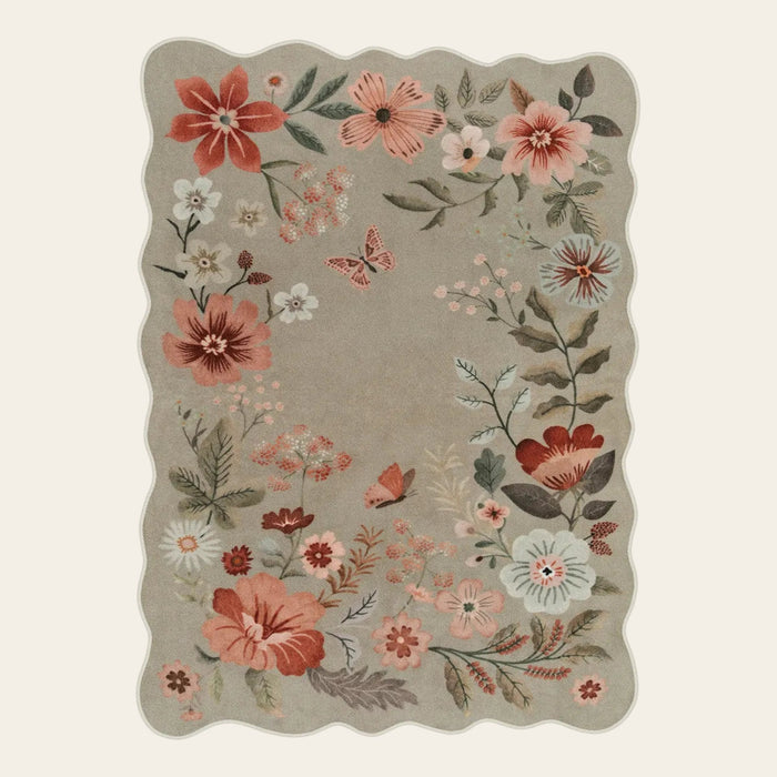 Covaba boho modern parisian floral scalloped area rug in coffee brown, shown flat on a plain ivory backdrop