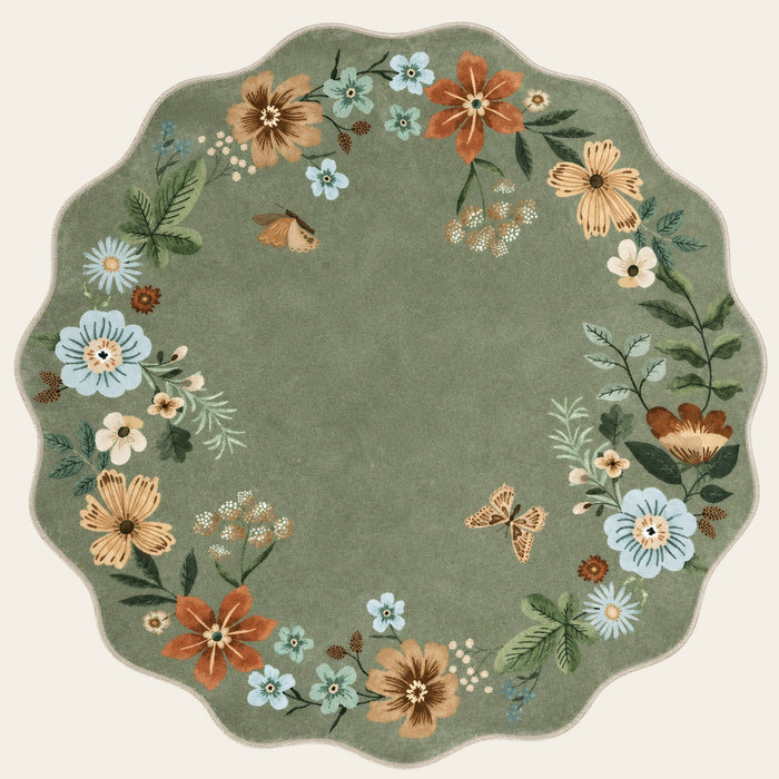 Covaba boho modern parisian floral scalloped round rug in fern green, shown flat on a plain ivory backdrop