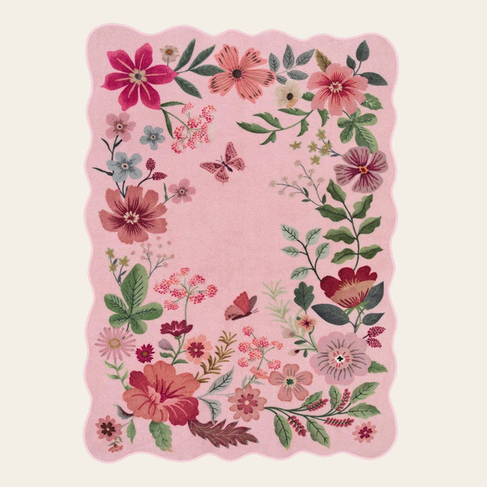 Covaba boho modern parisian floral scalloped doormat in blush clay, shown flat on a plain ivory backdrop
