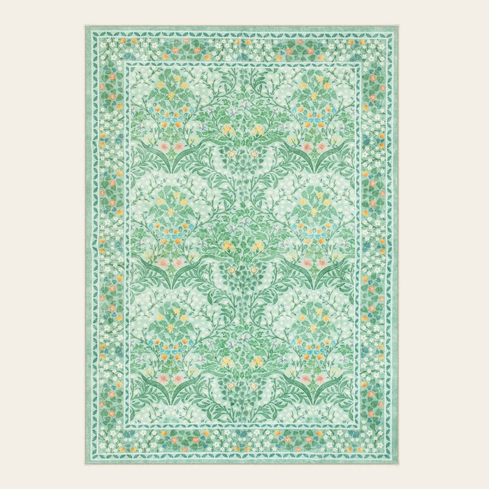Covaba maximalism vintage french floral area rug in willow sage, shown flat on a plain ivory backdrop