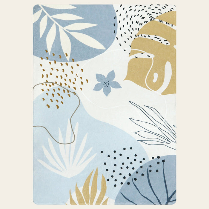 Covaba modern botanical leaf area rug in stormy blue, shown flat on a plain ivory backdrop