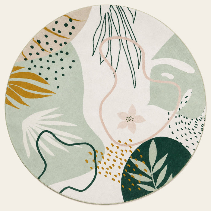 Covaba modern botanical leaf round rug in fern green, shown flat on a plain ivory backdrop