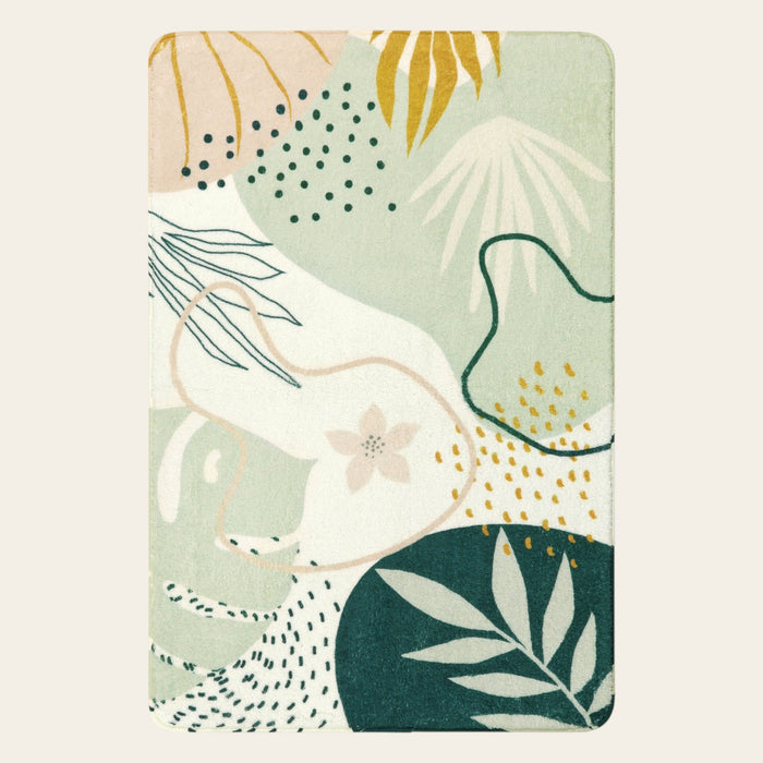 Covaba modern botanical leaf area rug in fern green, shown flat on a plain ivory backdrop