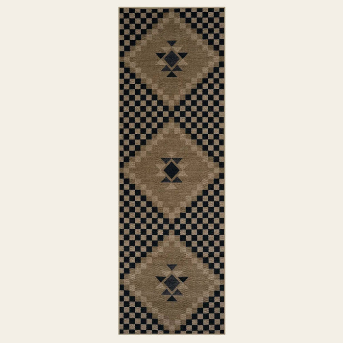 Covaba tribal soft easy jute indoor/outdoor runner rug in ink black, shown flat on a plain ivory backdrop