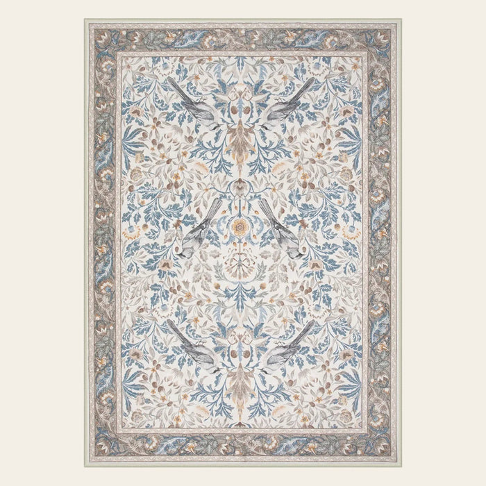 Covaba vintage floral bird area rug in fern green, shown flat on a plain ivory backdrop
