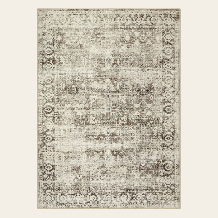 Covaba vintage distressed area rug in warm beige, shown flat on a plain ivory backdrop