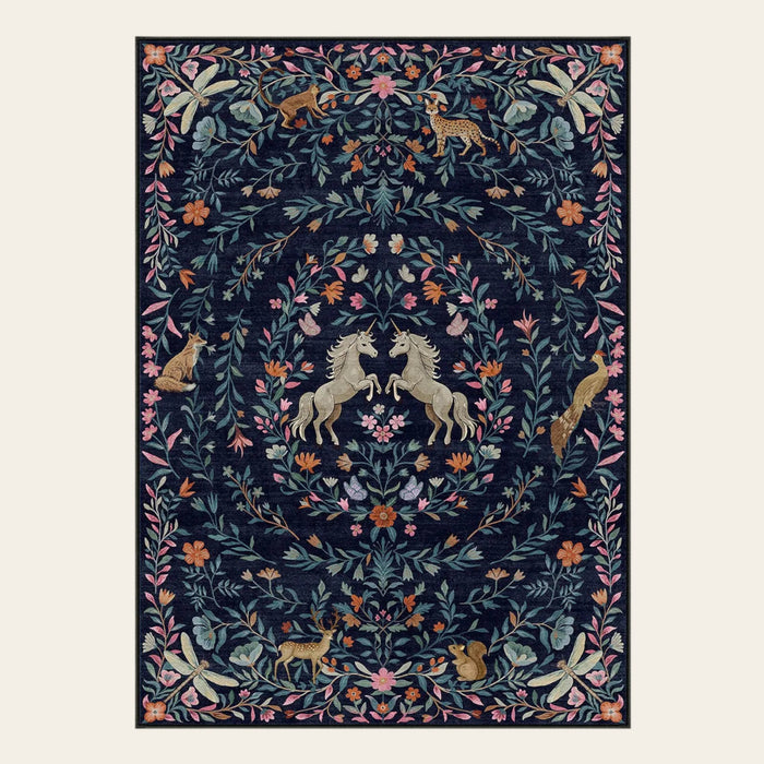 Covaba fantasy garden and unicorn area rug in deep navy, shown flat on a plain ivory backdrop
