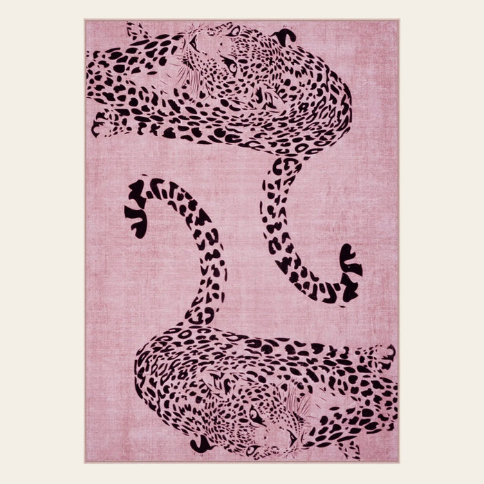 Covaba modern safari leopard area rug in blush clay, shown flat on a plain ivory backdrop