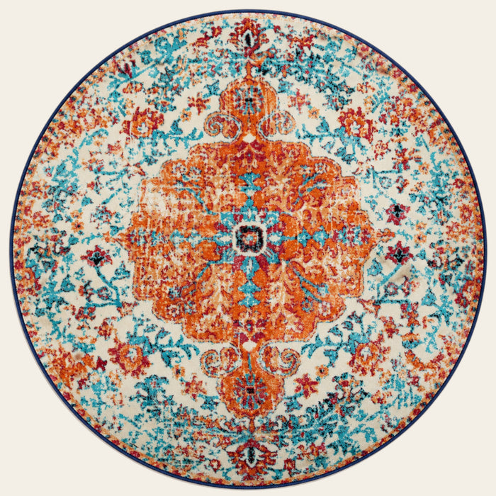 Covaba bohemian floral medallion round rug in amber clay, shown flat on a plain ivory backdrop
