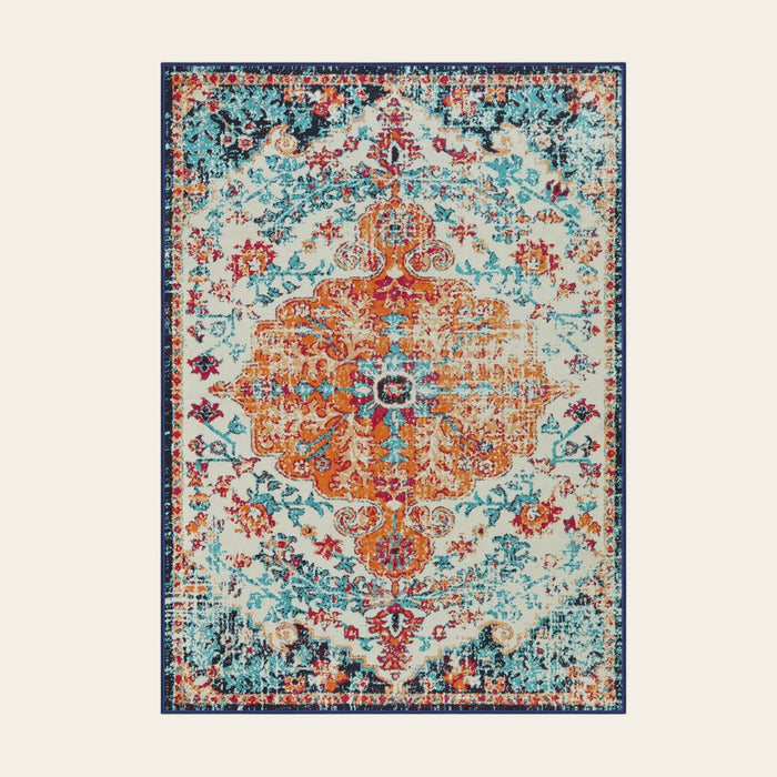 Covaba bohemian floral medallion area rug in amber clay, shown flat on a plain ivory backdrop