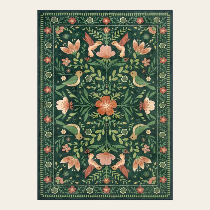 Covaba boho birdsong floral garden area rug in fern green, shown flat on a plain ivory backdrop