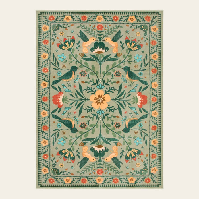 Covaba boho birdsong floral garden area rug in sage mist, shown flat on a plain ivory backdrop
