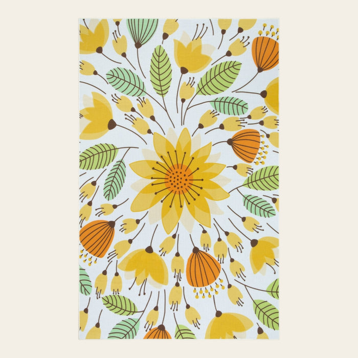 Covaba floral indoor outdoor area rug in golden wheat, shown flat on a plain ivory backdrop