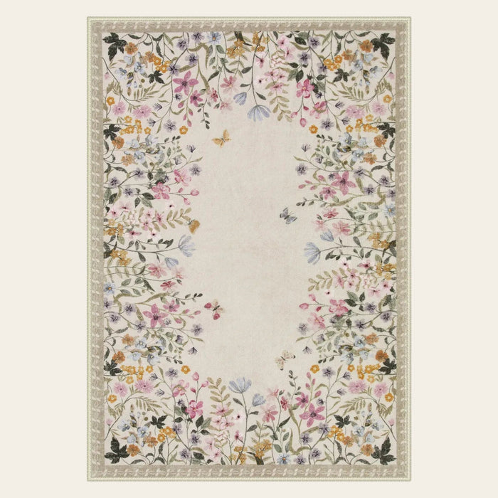 Covaba modern blooming floral garden area rug in warm beige, shown flat on a plain ivory backdrop
