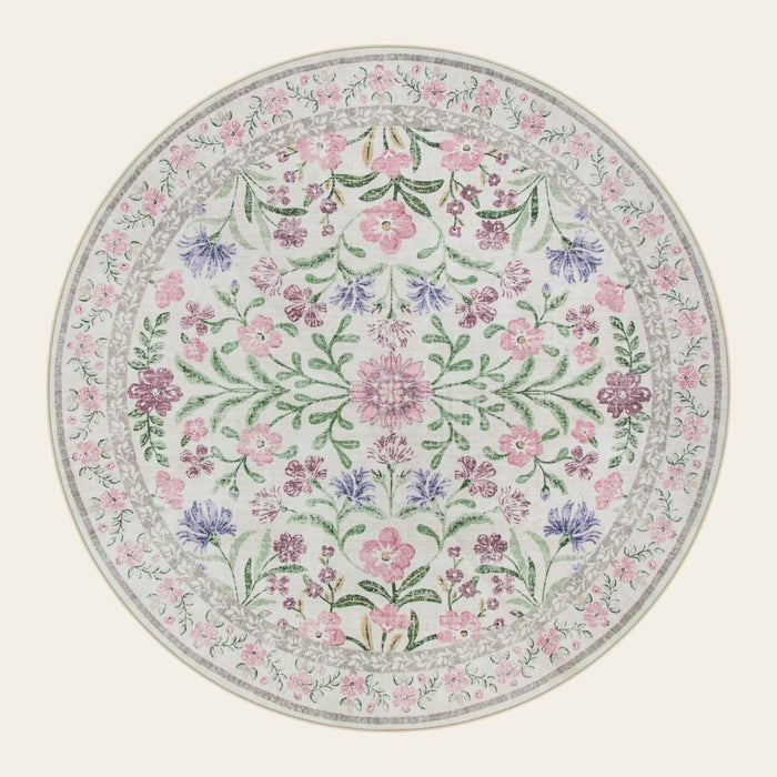 Covaba boho modern parisian garden floral round rug in muted plum, shown flat on a plain ivory backdrop