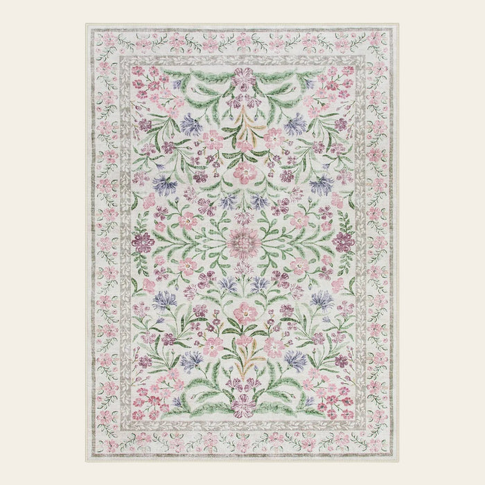 Covaba boho modern parisian garden floral area rug in muted plum, shown flat on a plain ivory backdrop