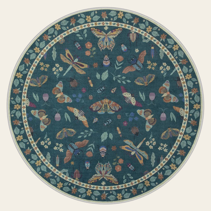 Covaba modern parisian insect round rug in fern green, shown flat on a plain ivory backdrop