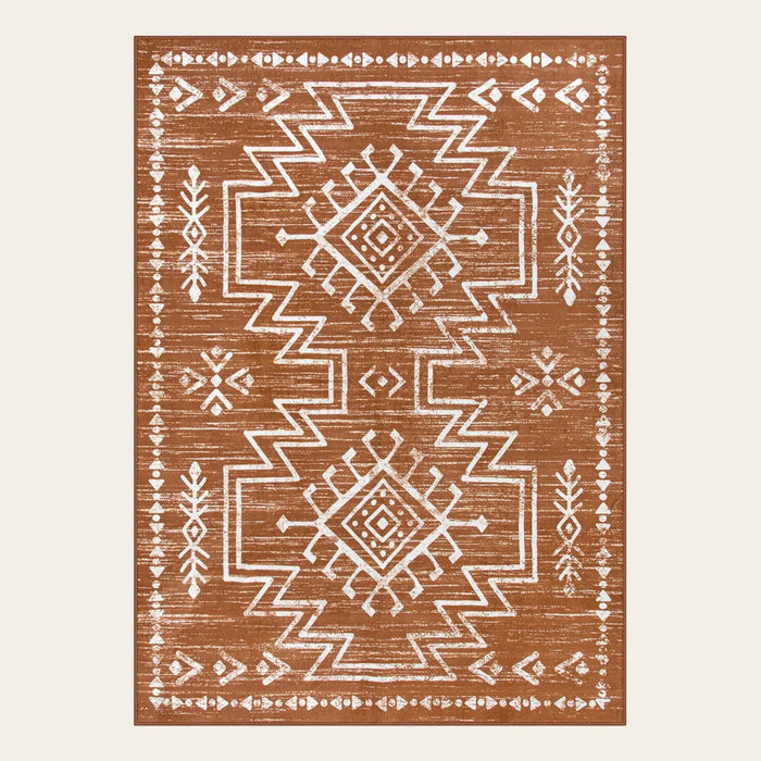 Covaba aztec moroccan distressed area rug in amber clay, shown flat on a plain ivory backdrop