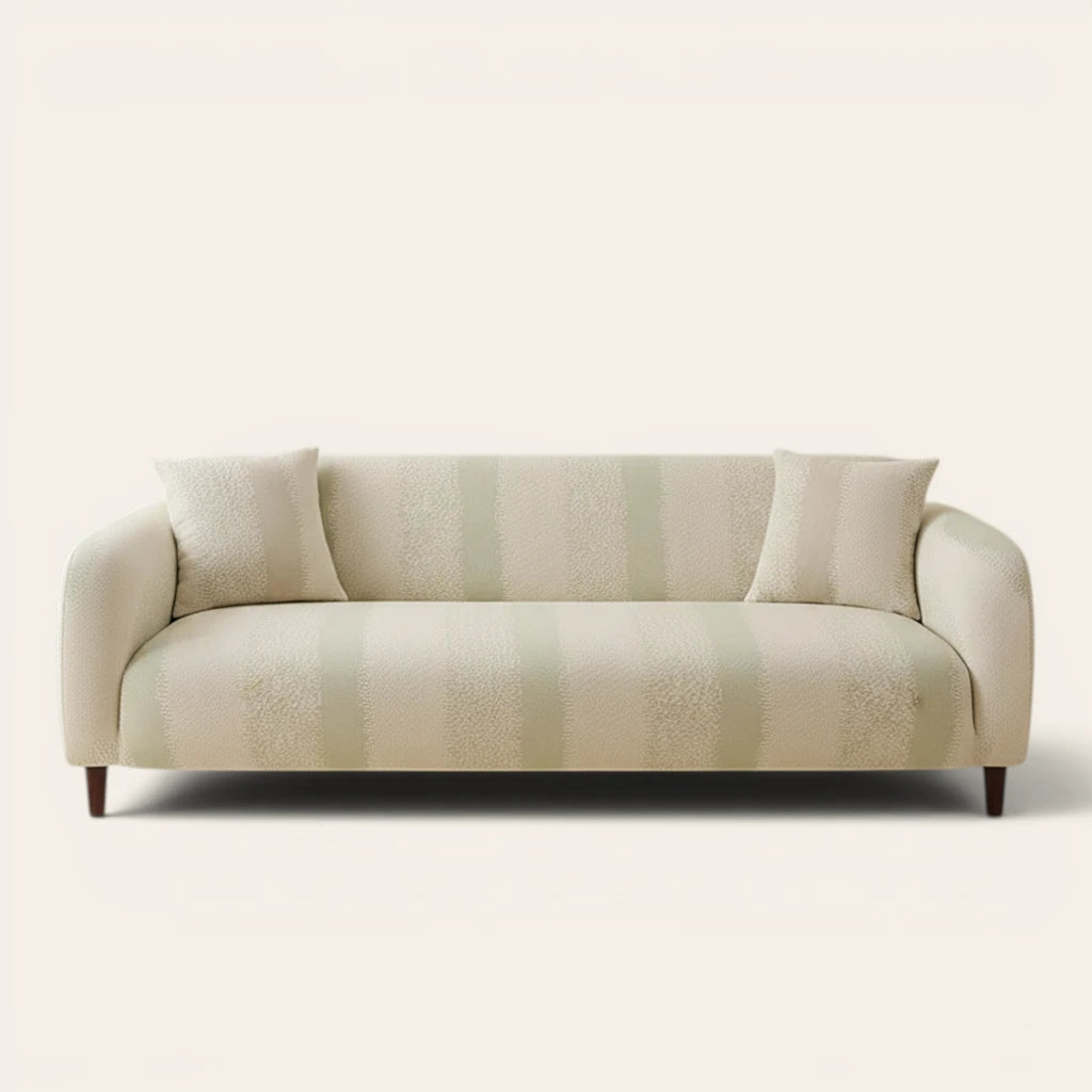 Cream jacquard sofa cover with soft sage stripes on a three-seater, front view on ivory backdrop with matching cushions