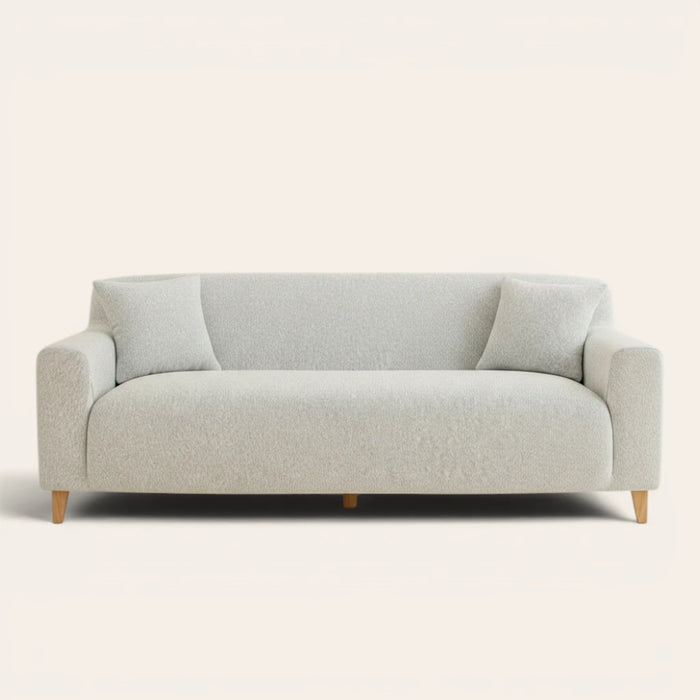 Silver grey knit sofa cover fitted on a three-seater, front view on ivory backdrop