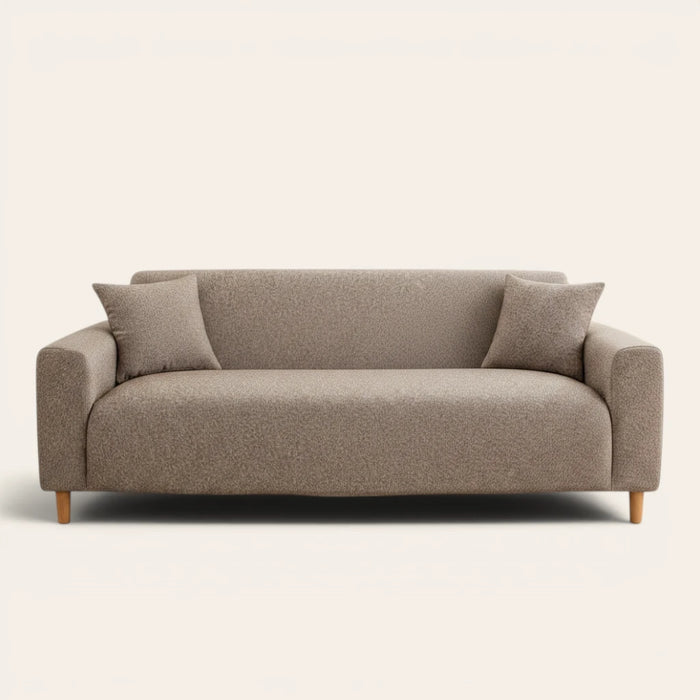 Warm taupe knit sofa cover fitted on a three-seat couch with matching cushions, front view on ivory.
