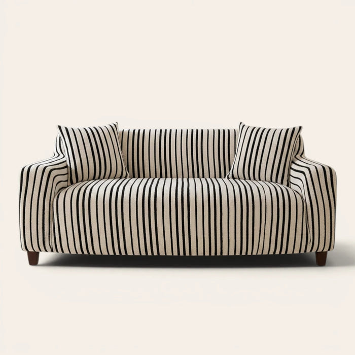 Midnight black striped sofa cover on a three-seat sofa with matching cushions, front view on ivory