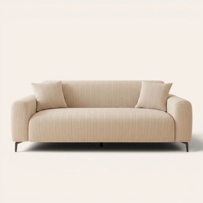 Almond cream waffle sofa cover fitted on a three-seat sofa, front view on ivory backdrop