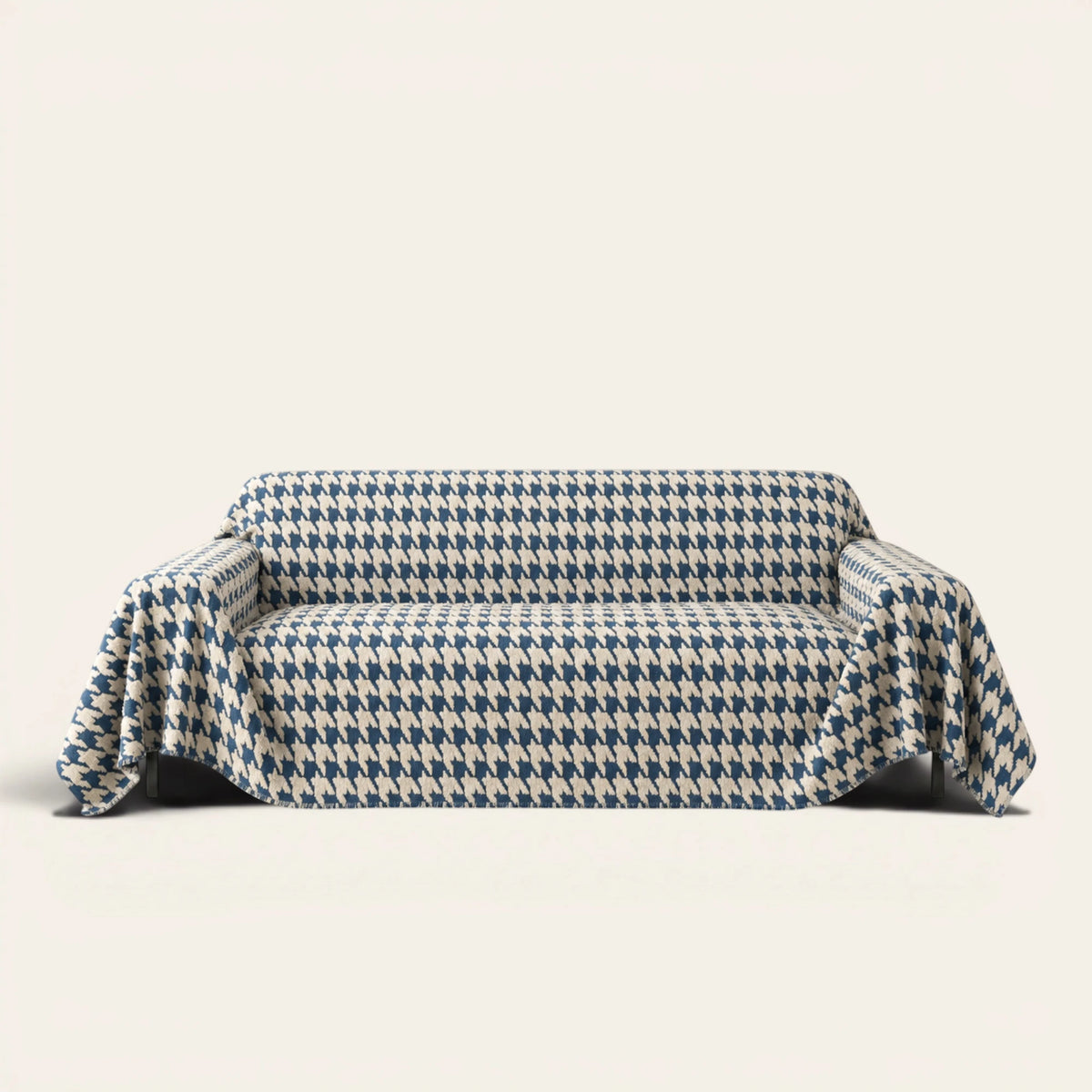 Cozy Houndstooth Ocean Blue sofa throw draped over a three-seat sofa, front view on ivory