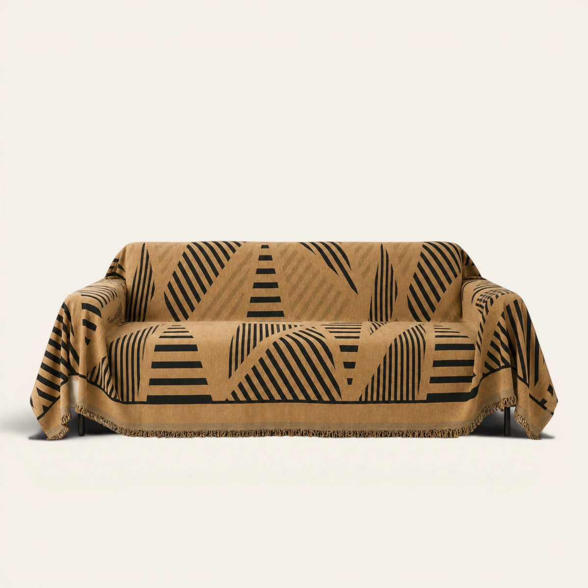 Savanna Earth Modern Jungle throw draped over a two-seat sofa on ivory background