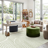 Covaba abstract rainbow stripe green/white area rug in fern green, styled in a room setting, view 8