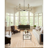 Covaba abstract rainbow stripe orange/white area rug in amber clay, shown flat on a plain ivory backdrop, view 3