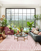 Covaba abstract rainbow stripe pink/white area rug in blush clay, styled in a room setting, view 14