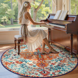 Covaba bohemian floral medallion round rug in amber clay, styled in a room setting, view 2
